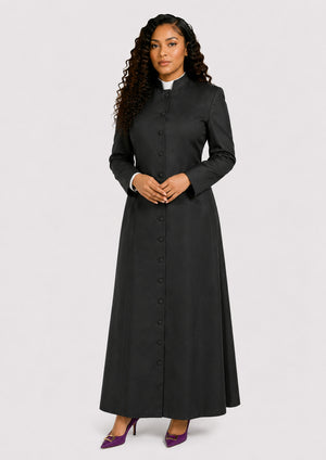 Woman wearing a black long cassock with a white collar on a  white background