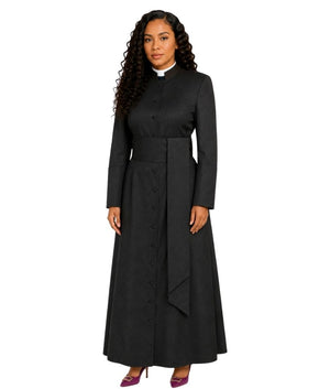 A woman modeling a long black cassock with a high stand collar, front button closure, and a matching waist tie, shown against a plain white background.