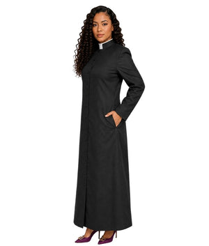 A woman modeling a long black cassock with a white collar, standing against a plain white background.