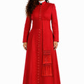 Woman wearing a red cassock with a matching scarf on a white background
