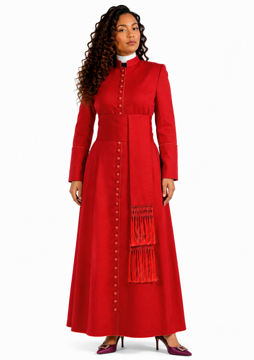 Woman wearing a red cassock with a matching scarf on a white background
