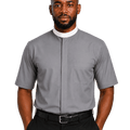 A man wearing a gray short-sleeve clerical shirt with a white collar, paired with black trousers and a black belt, against a plain white background.