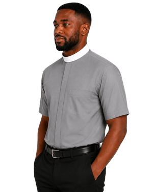 A man wearing a light gray short-sleeve clerical shirt with a white collar, paired with black trousers and a black belt, shown against a plain white background.
