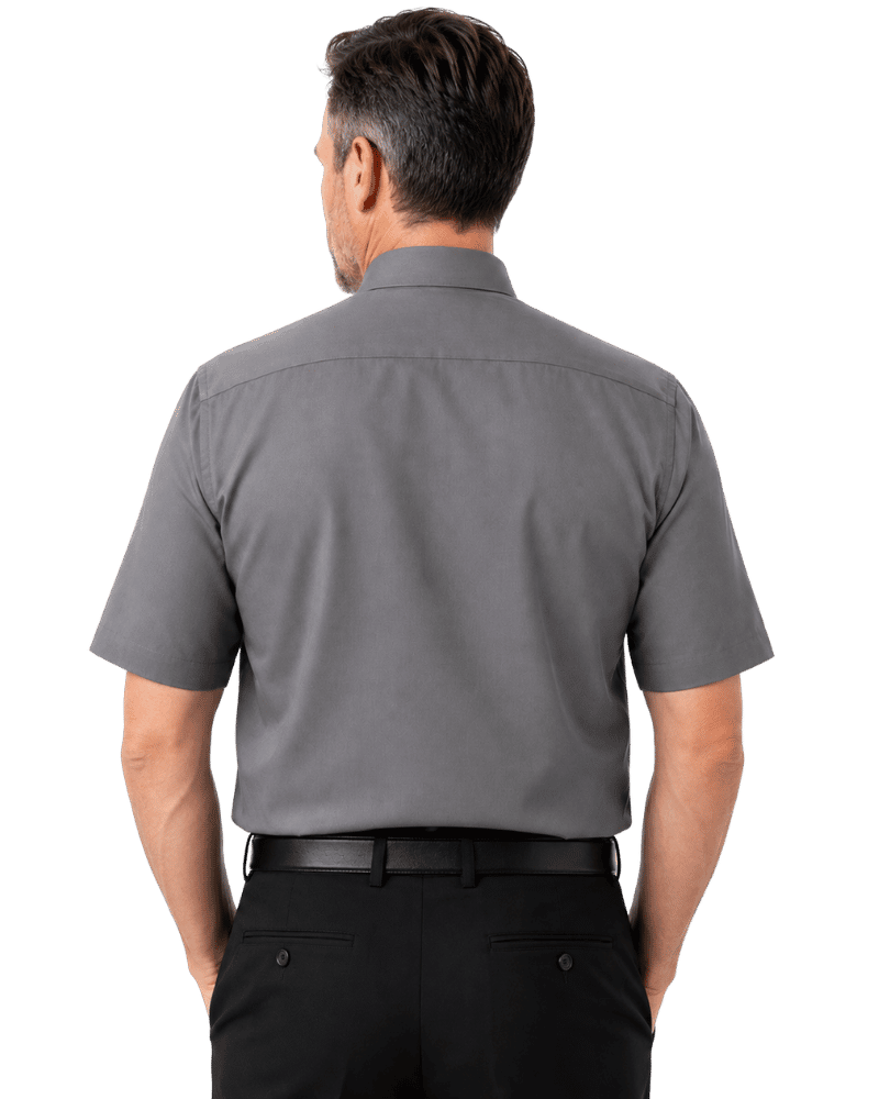 A man viewed from the back wearing a short-sleeve gray clerical  shirt and black trousers, isolated on a white background.