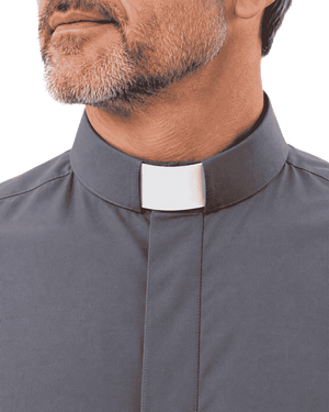 Close-up of a man wearing a dark gray clerical shirt with a white collar tab, shown against a plain white background.