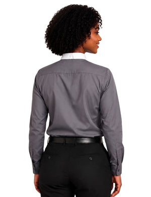 A woman shown from the back wearing a gray long-sleeve clerical shirt with a white collar, tucked into black pants with a black belt, against a plain white background.