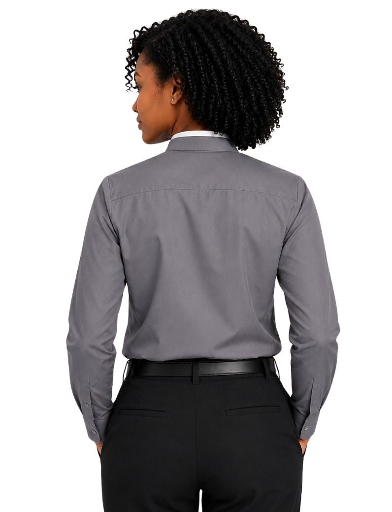 A woman shown from the back wearing a gray long-sleeve clerical shirt tucked into black trousers with a black belt, against a plain white background.