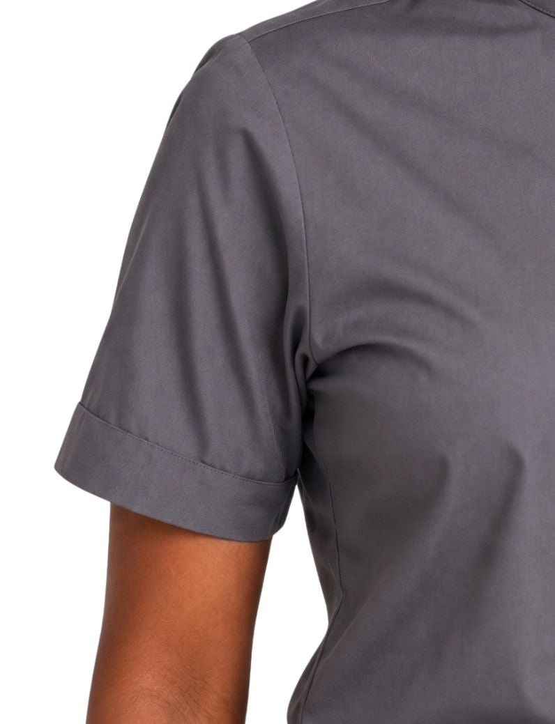 Close-up of a woman wearing a short-sleeve gray clerical shirt, showing the sleeve cuff and upper torso against a plain white background.
