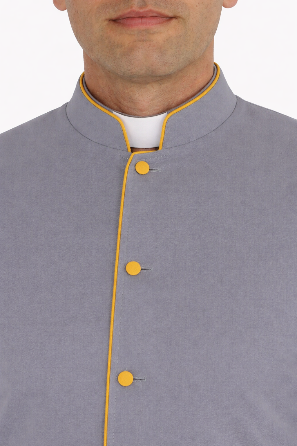 Close-up of a gray robe with yellow buttons on a white background