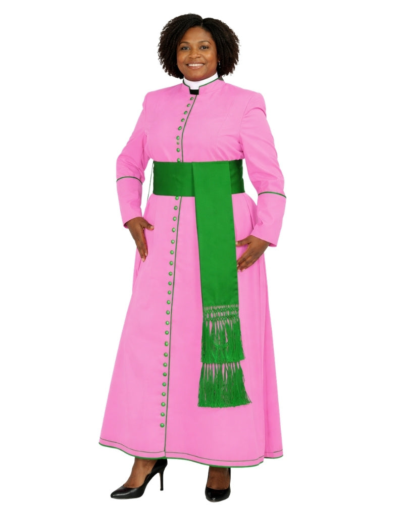 A woman modeling a pink clerical-style long cassock with a wide green sash and green trim, shown against a plain white background.
