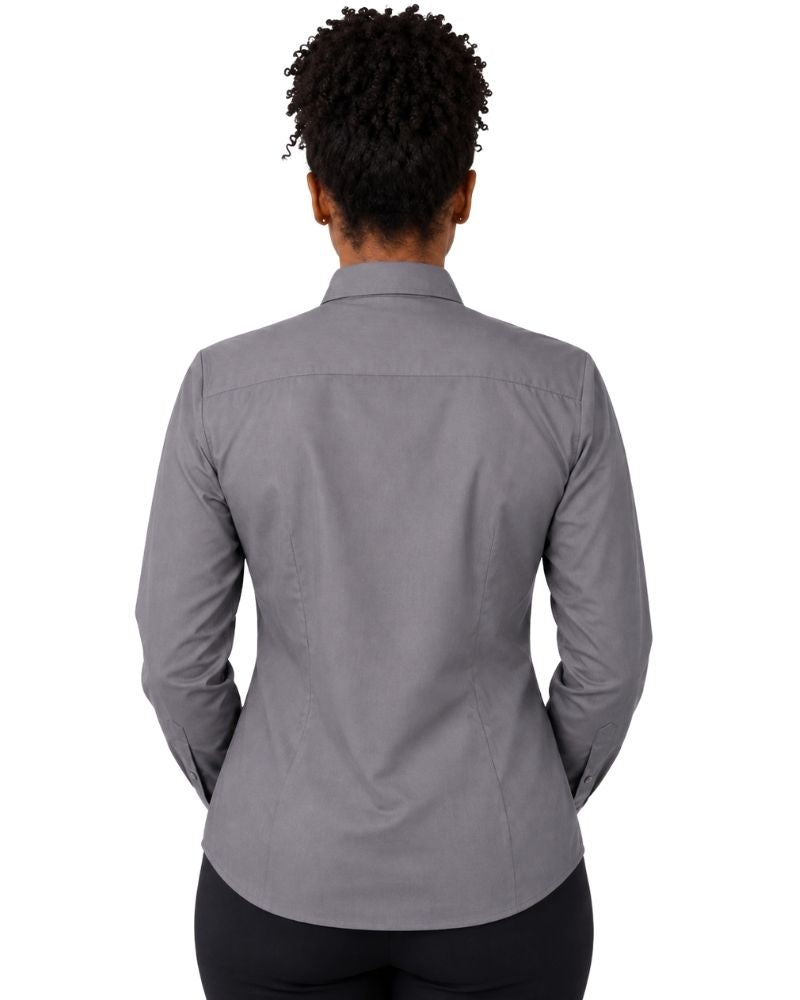 A woman viewed from the back wearing a gray long-sleeve clerical shirt and black pants, set against a plain white background.