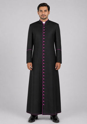 Man wearing a black robe with pink accents on a gray background