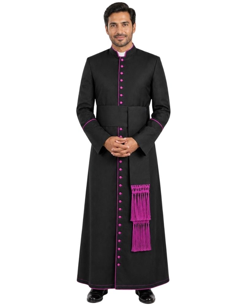 A man modeling a long black clerical cassock with bright purple trim, purple buttons, and a purple hanging sash, shown against a plain white background.