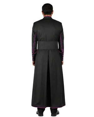 A man viewed from the back wearing a long black Cassock  with bright pink trim along the collar, cuffs, and hem, against a plain white background.