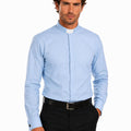 Man wearing a light blue clerical shirt with a collar on a white background