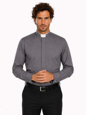 Man wearing a gray clerical shirt with a white collar on a white background