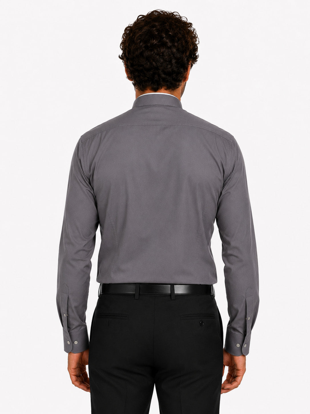 Man wearing a gray clerical shirt and black pants on a white background