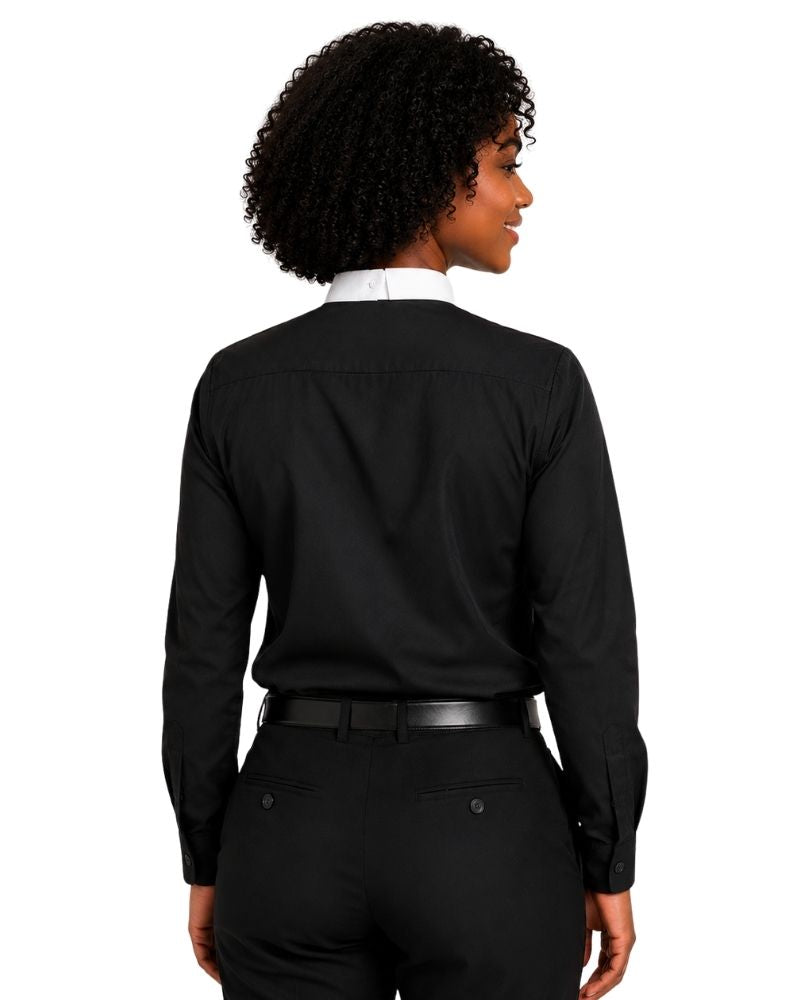 A woman shown from the back wearing a black long-sleeve clerical shirt with a white collar, paired with black trousers and a black belt, against a plain white background.