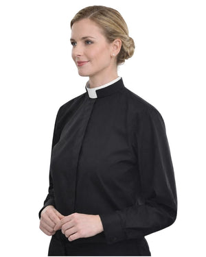 A woman wearing a black long-sleeve clerical-style blouse with a white collar, shown against a plain white background.