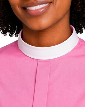 Close-up of a woman wearing a pink top with a contrasting white high collar, cropped from the mouth to the chest against a plain white background.
