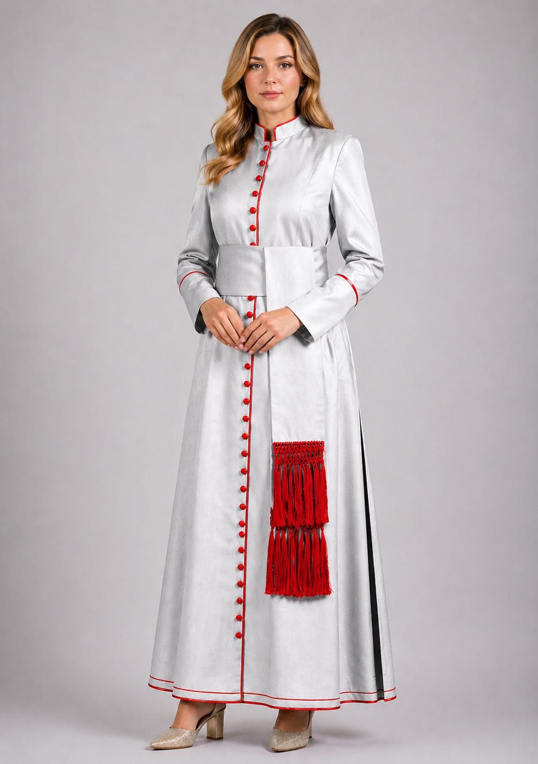 Woman wearing a long white dress with red accents on a plain background