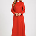 Woman wearing a red dress on a white background