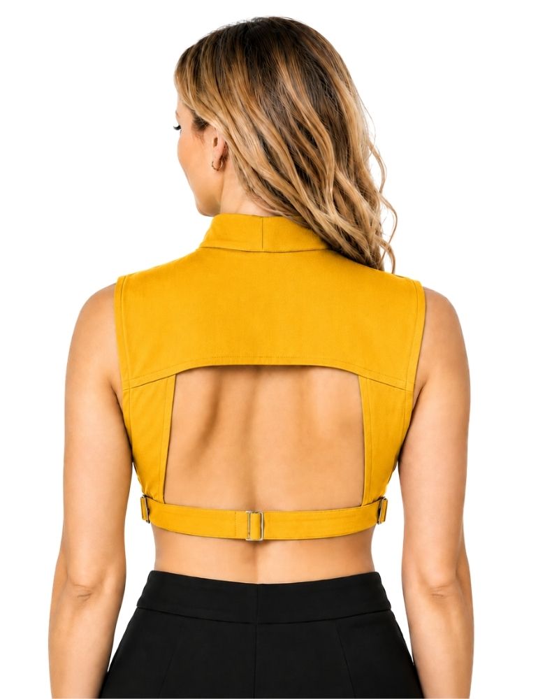 A woman shown from the back wearing a mustard yellow sleeveless clergy dickey and a wide adjustable waist belt, paired with black bottoms, against a plain white background.