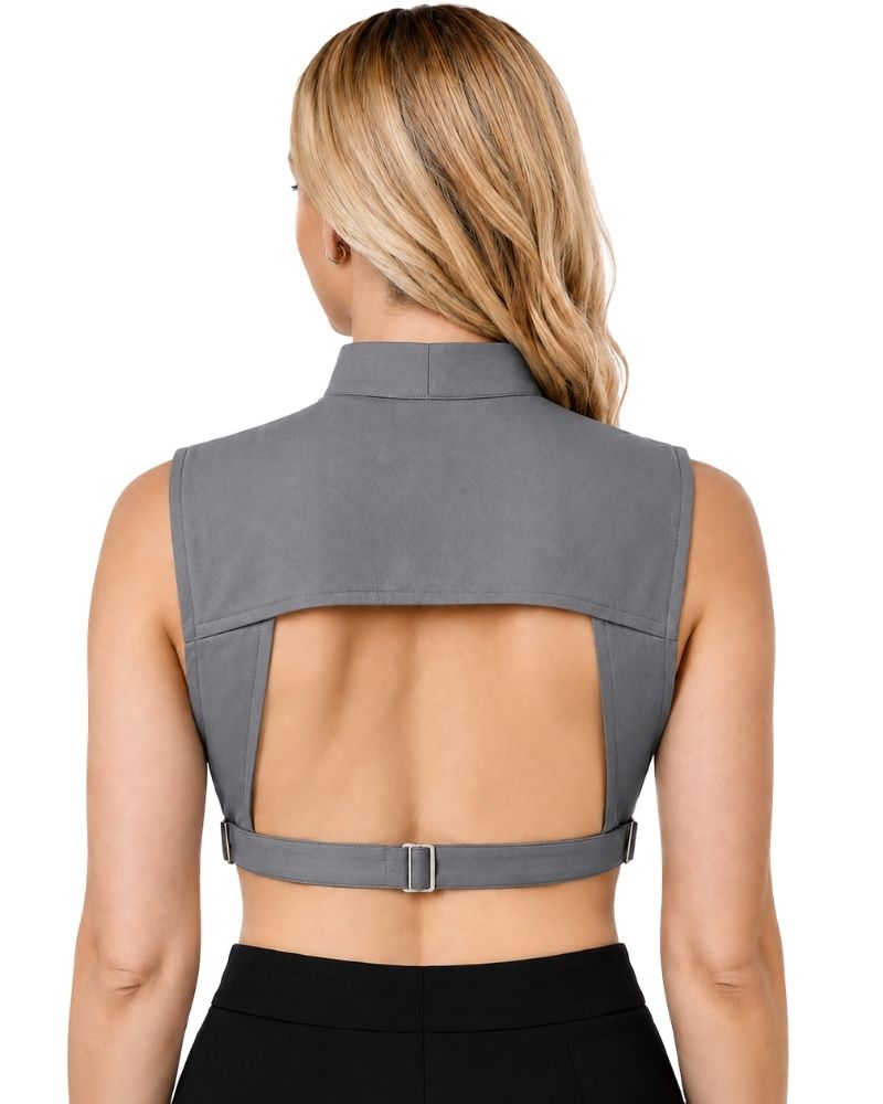 A woman viewed from the back wearing a gray sleeveless clergy dickey and a thin waist strap with a metal buckle, paired with black bottoms, against a plain white background.