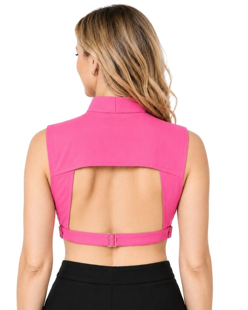 A woman shown from the back wearing a sleeveless pink clergy dickey with a high mock neck and an open back design, paired with black bottoms, against a plain white background.
