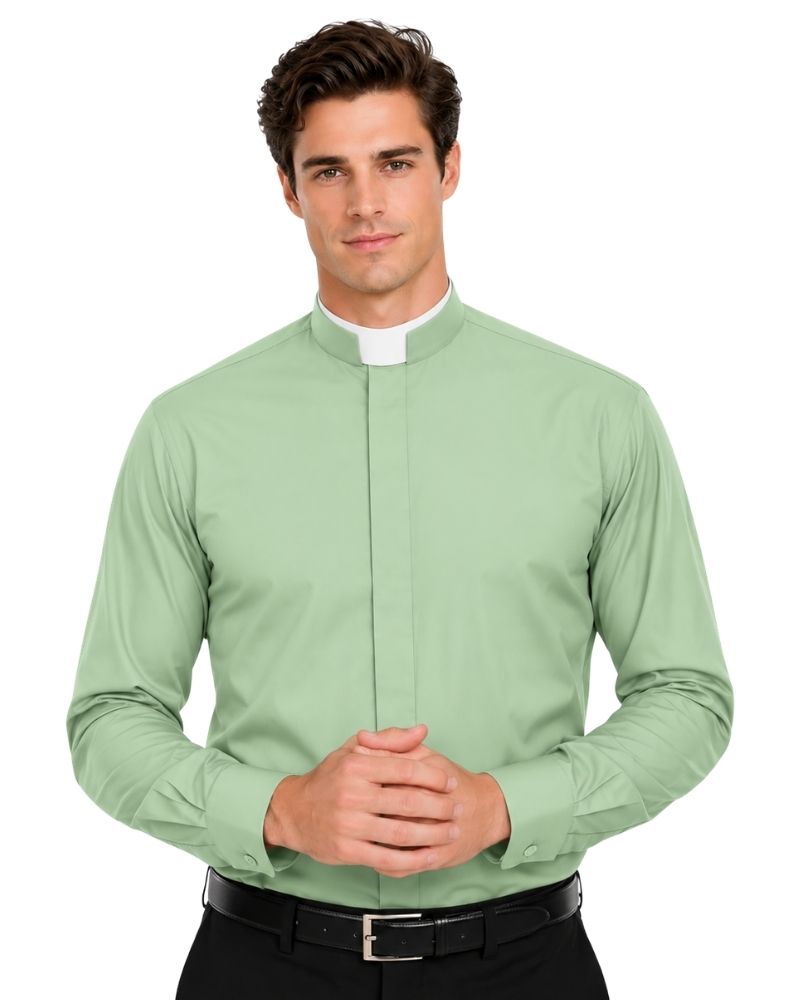 A man wearing a light sage green long-sleeve clerical shirt with a white collar, paired with a black belt, against a plain white background.