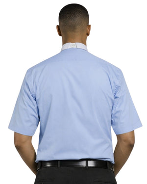 Man wearing a light blue shirt with a white collar and black pants on a white background
