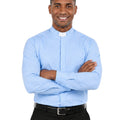 Man wearing a light blue shirt and black pants on a white background