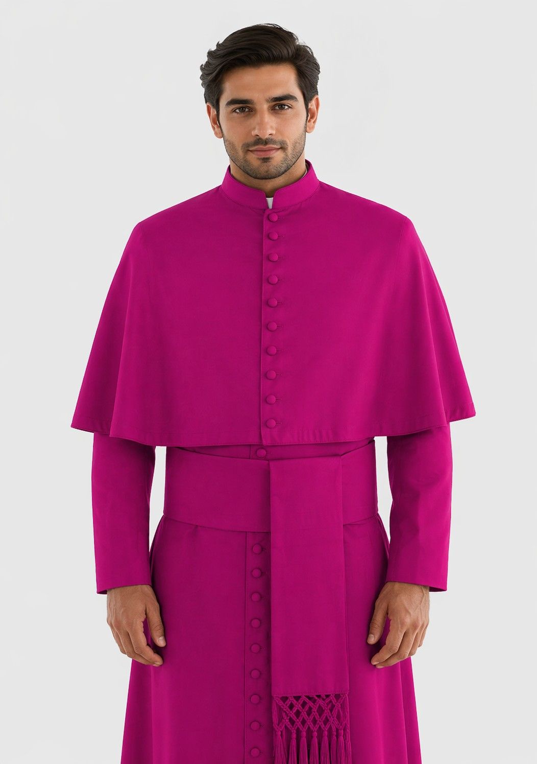Man wearing a bright pink robe on a white background