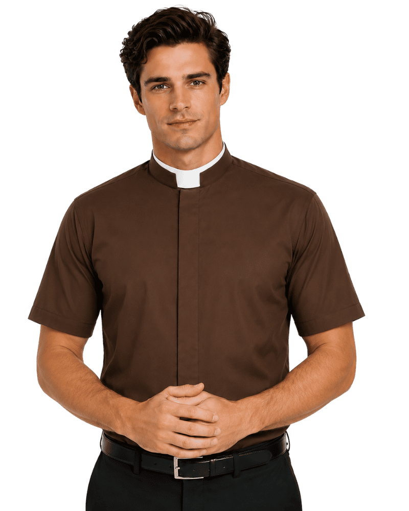 A man wearing a brown short-sleeve clerical shirt with a white collar, paired with a black belt and dark trousers, standing against a solid white background.