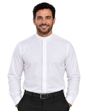 A smiling man wearing a white long-sleeve clerical shirt with a high mock neck collar, paired with black trousers and a black belt, against a plain white background.