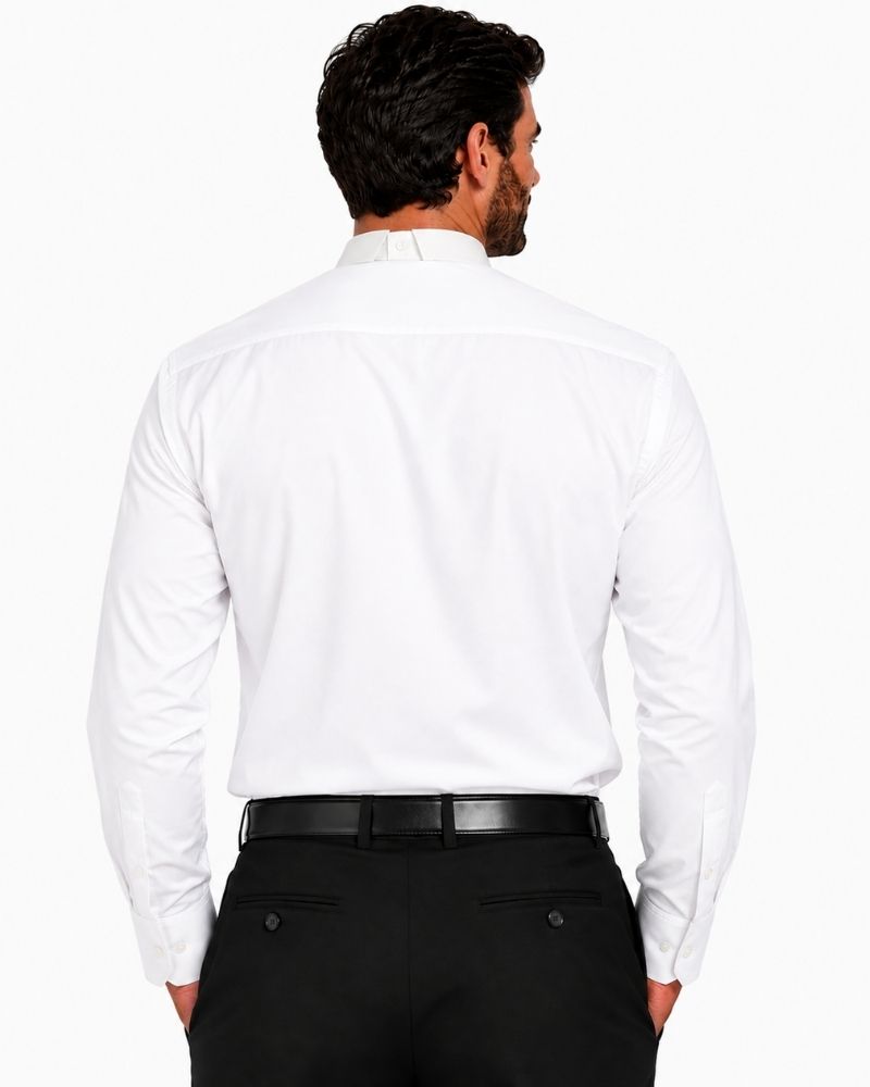 A man viewed from the back wearing a white long-sleeve clerical shirt tucked into black trousers with a black belt, against a plain white background.