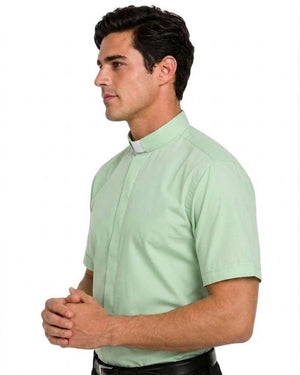 A man wearing a light sage green short-sleeve clerical shirt with a traditional collar, shown in profile against a plain white background.