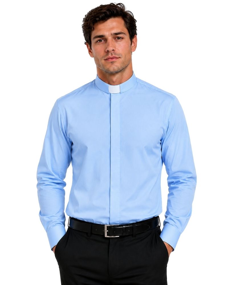 A man wearing a light blue long-sleeve clerical shirt with a white collar tab, paired with black trousers and a black belt, against a plain white background.