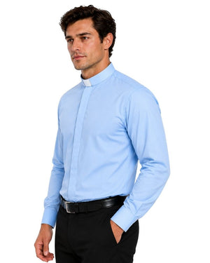 A man wearing a light blue long-sleeve clerical shirt with a clerical collar, paired with black trousers and a black belt, photographed against a solid white background.