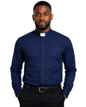 A man wearing a navy blue long-sleeve clerical shirt with a white collar tab, paired with black trousers and a black belt, against a plain white background.