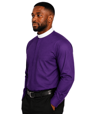 A man wearing a long-sleeve purple clerical shirt with a white mock neck collar, paired with black trousers and a black belt, shown against a plain white background.