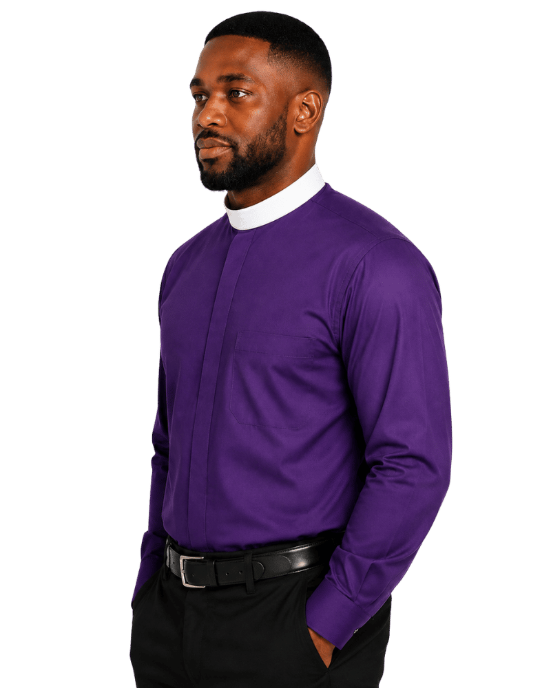 A man wearing a long-sleeve purple clerical shirt with a white mock neck collar, paired with black trousers and a black belt, shown against a plain white background.