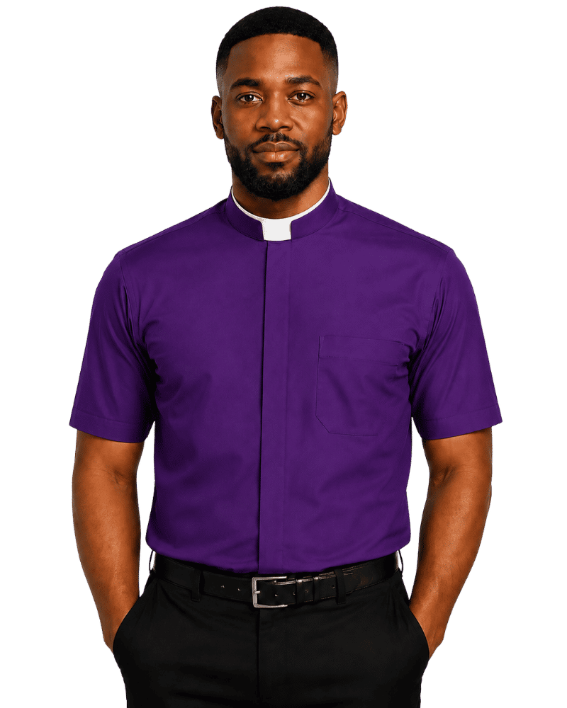 A man wearing a purple short-sleeve clerical shirt with a white collar tab, paired with black trousers and a black belt, against a plain white background.