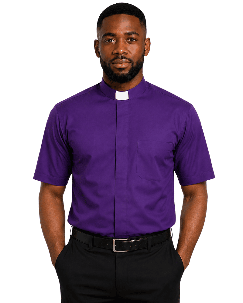 A man wearing a purple short-sleeve clerical shirt with a white collar tab, paired with black trousers and a black belt, photographed against a plain white background.