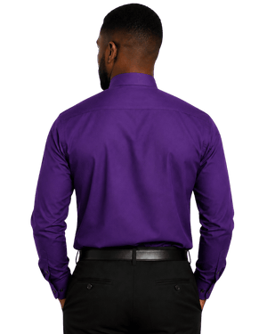 A man viewed from the back wearing a solid purple long-sleeve clerical shirt and black trousers, isolated on a white background.
