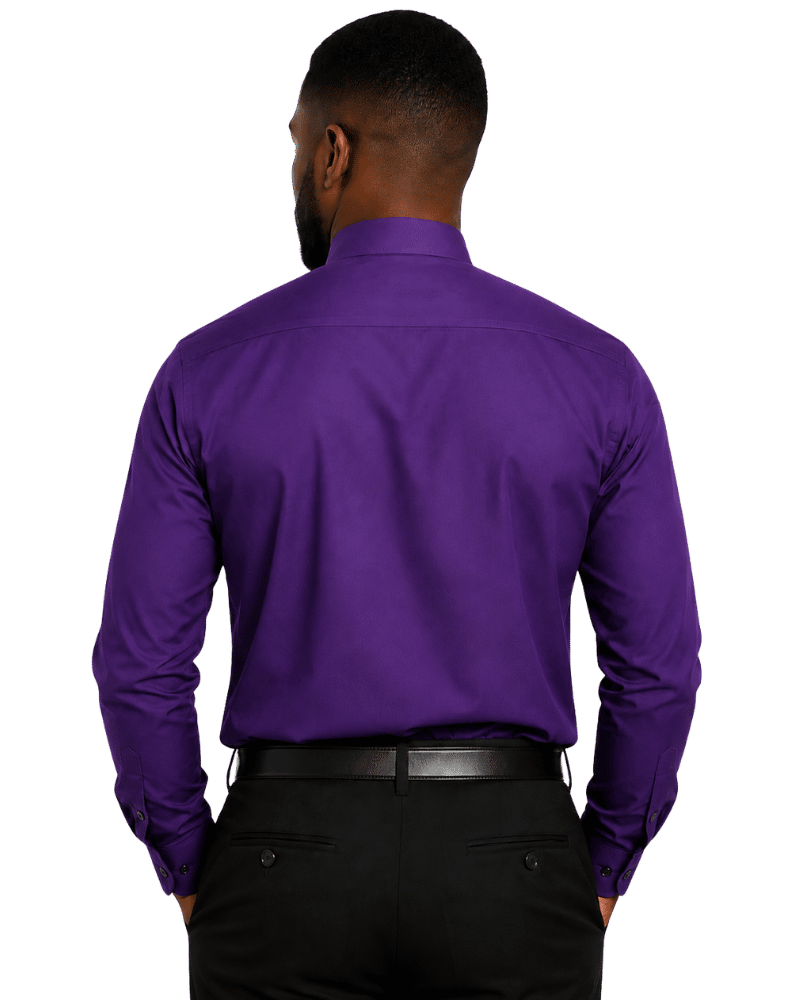 A man viewed from the back wearing a solid purple long-sleeve clerical shirt and black trousers, isolated on a white background.