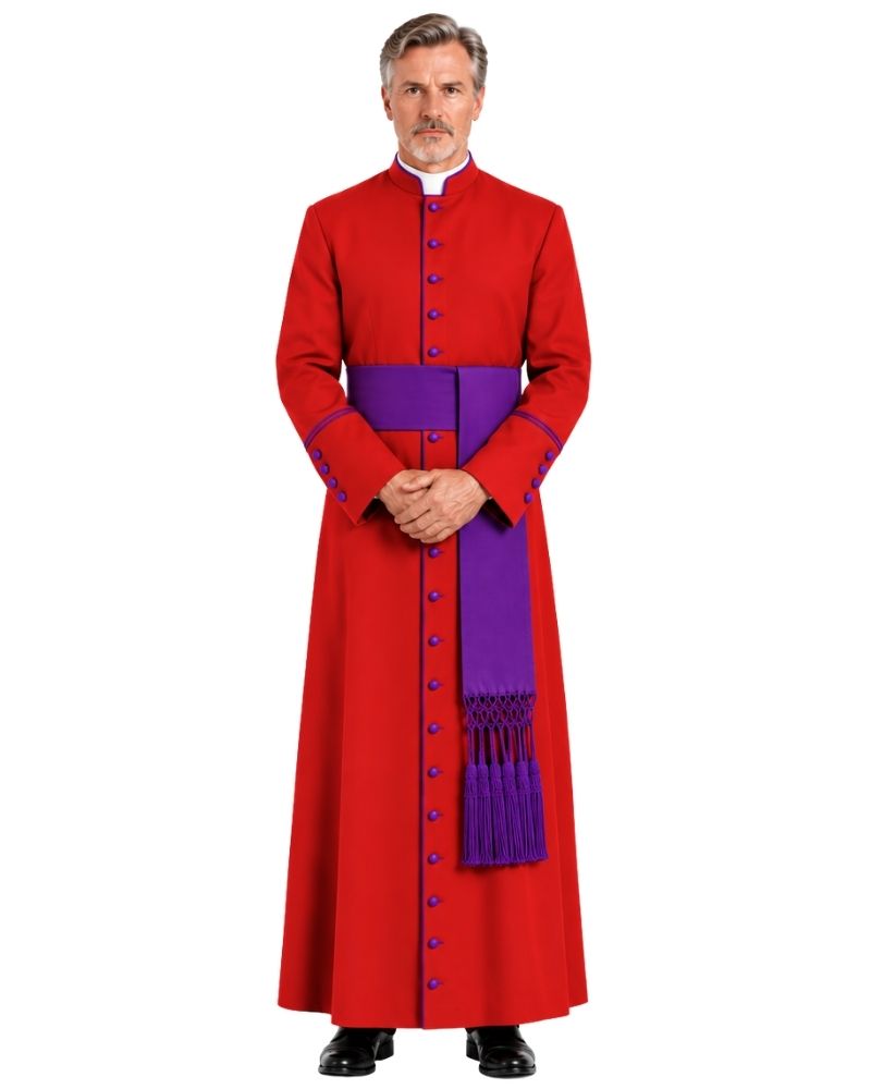 A man wearing a Red Clergy Robe With Purple Trim with a high collar, front buttons, and a cape like shoulder drape, standing against a plain white background.
