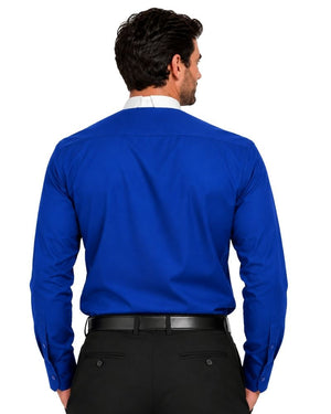 A man viewed from the back wearing a bright royal blue long-sleeve clerical shirt tucked into black trousers with a black belt, against a plain white background.