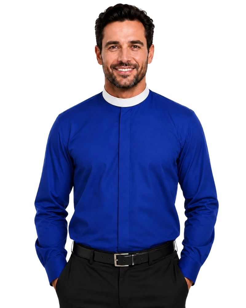 A smiling man wearing a royal blue long-sleeve clerical shirt with a white collar, paired with black trousers and a black belt, against a plain white background.