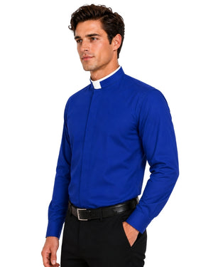A man wearing a royal blue long-sleeve clerical shirt with a white collar, paired with black trousers and a black belt, photographed against a solid white background.